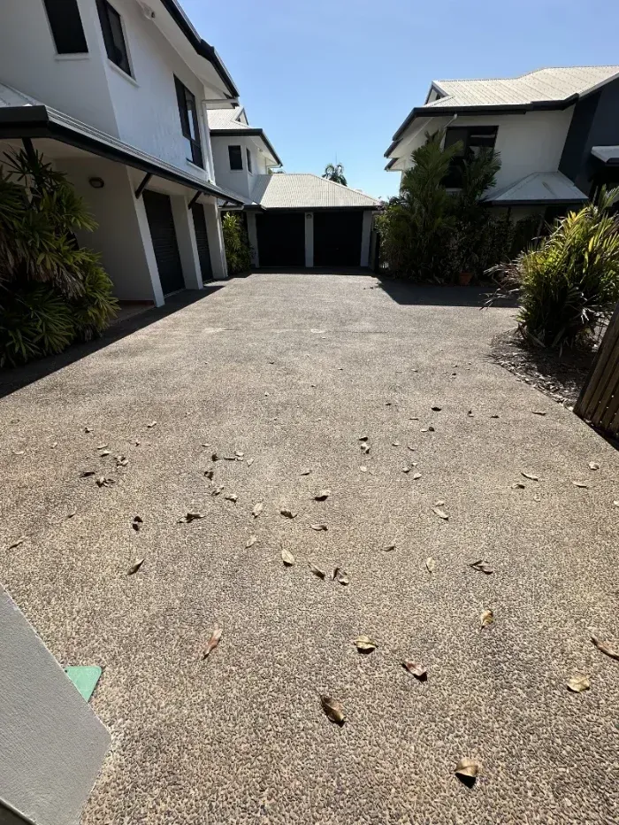 A Driveway Between Two White Houses Leading to A Detached Garage — I Do It All in Caloundra, QLD