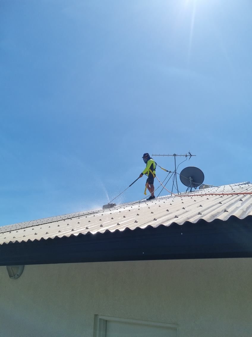 Person in a High-visibility Yellow Shirt Uses a Pressure Washer — I Do It All in Caloundra, QLD