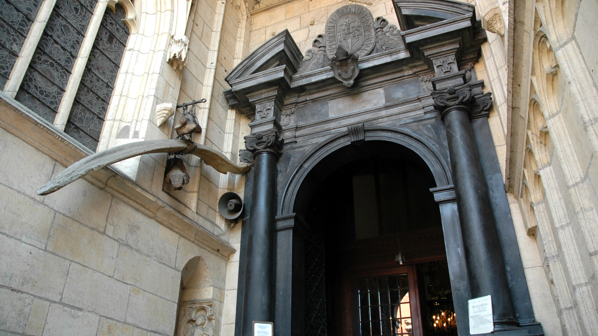 Detail of a historic Jewish Quarter building in Krakow with a Star of David on the facade.