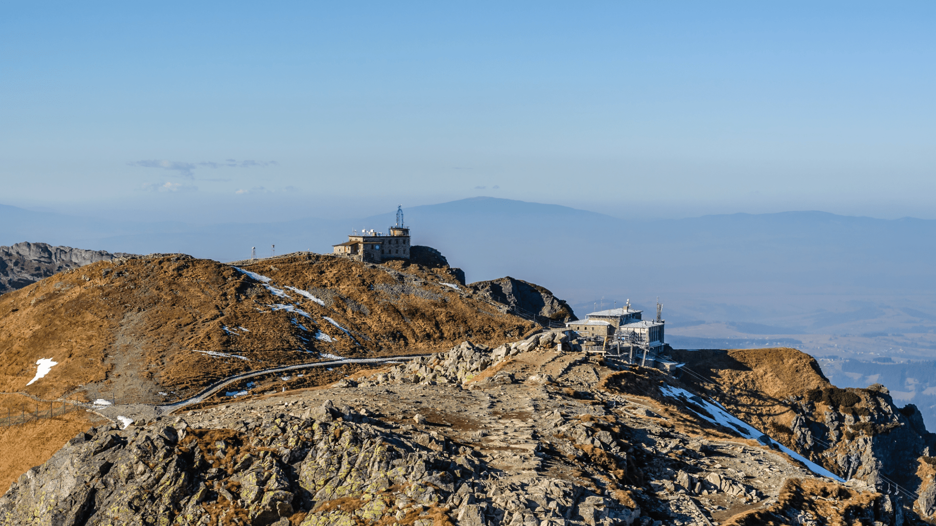 Hikers standing on a rocky ridge in the Zakopane mountains