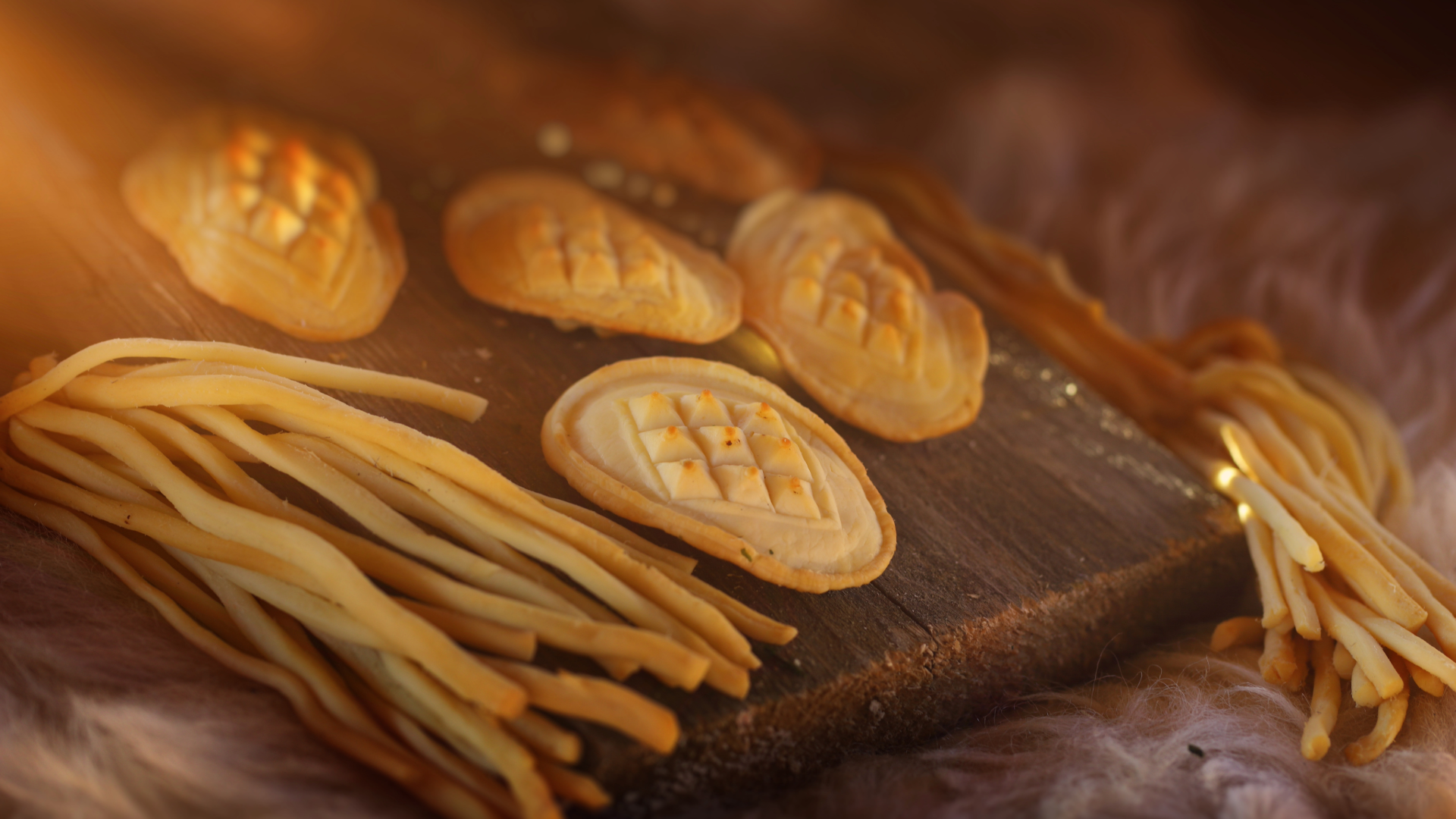Traditional smoked Polish oscypek cheese and bread displayed on a wooden platter