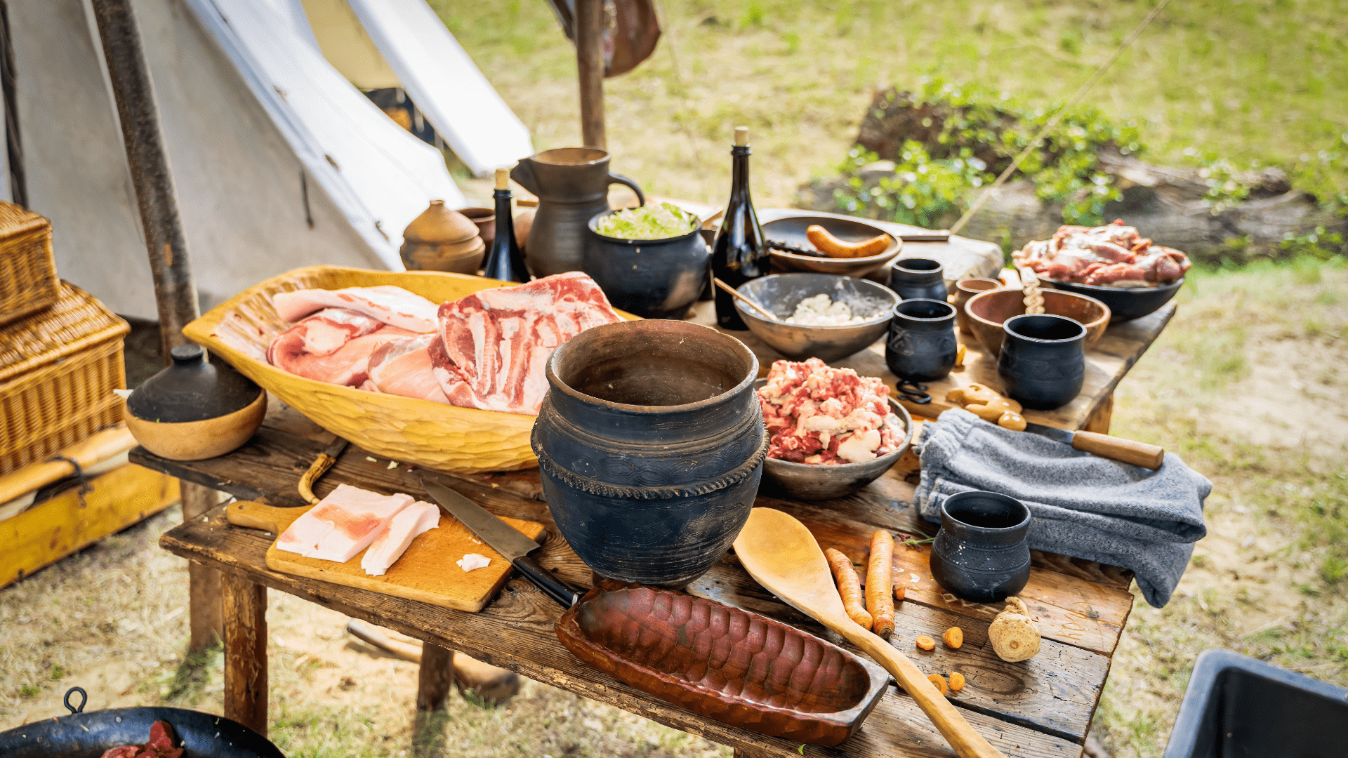Colorful Polish pottery displayed on a wooden market stall