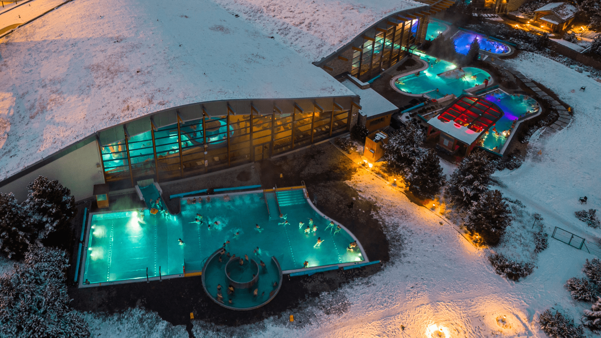 Aerial night view of turquoise thermal pools in Zakopane
