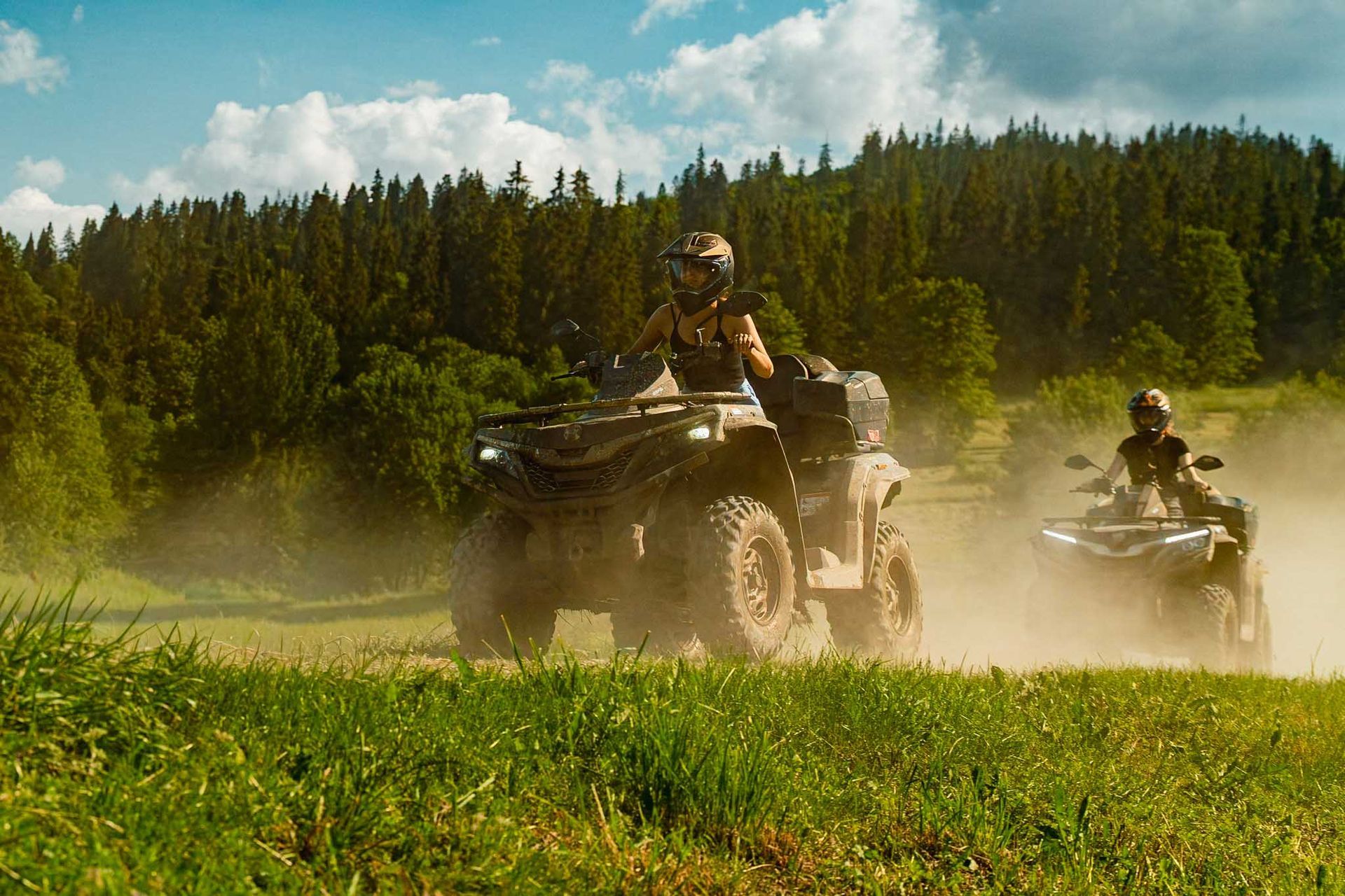 Quad rider driving on a gravel mountain trail in the Tatra area near Krakow.
