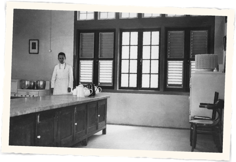 A black and white photo of a man in a lab t Klooster Hotel Curacao