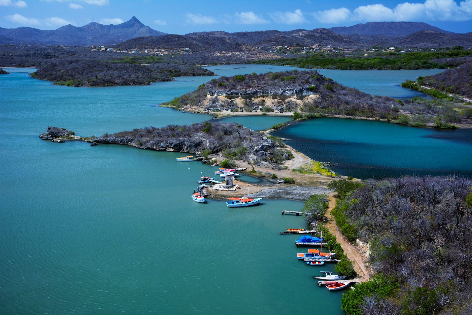 An aerial view of a small island in the middle of a large body of water.