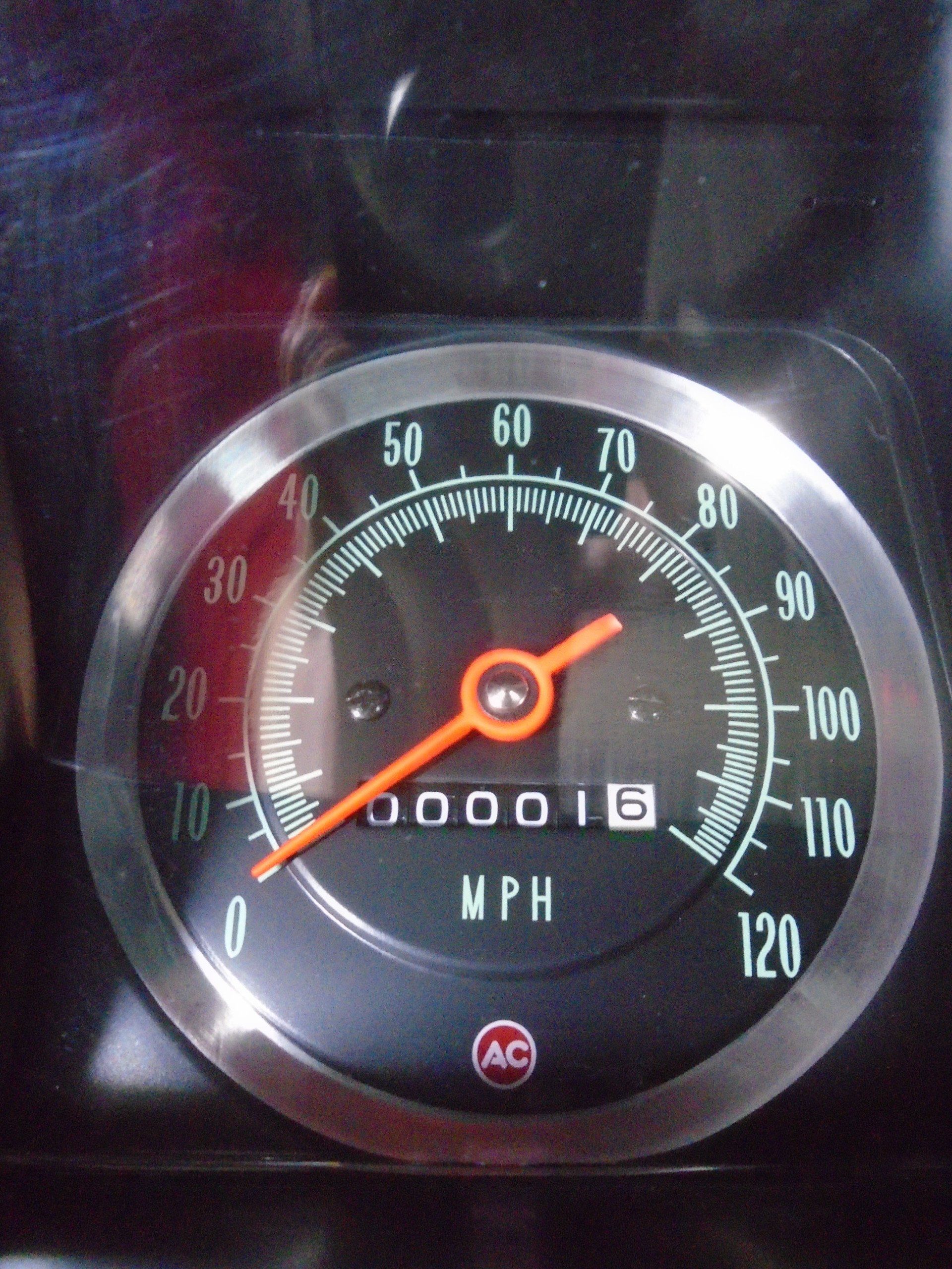 Close-up of a car speedometer displaying 16 MPH. 