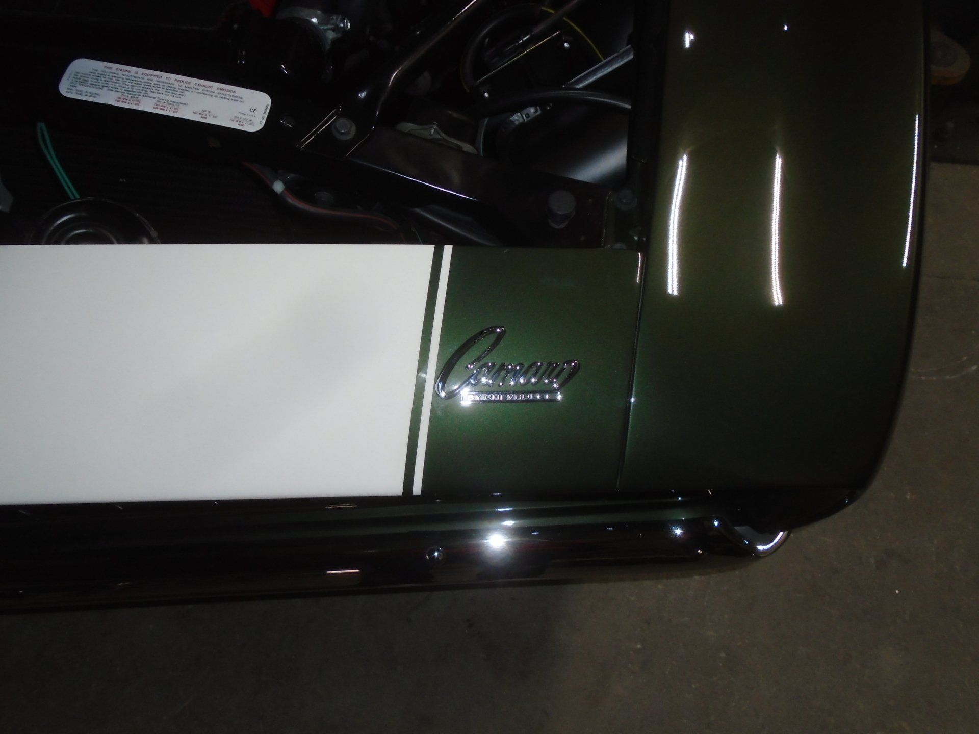 Green car fender with white stripe and 