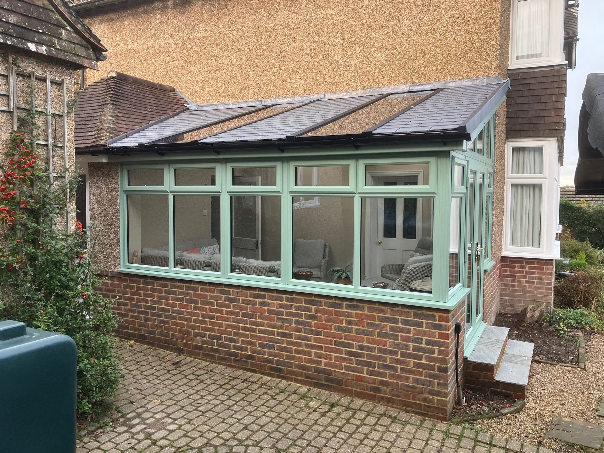 exterior side view of chartwell green conservatory in sussex