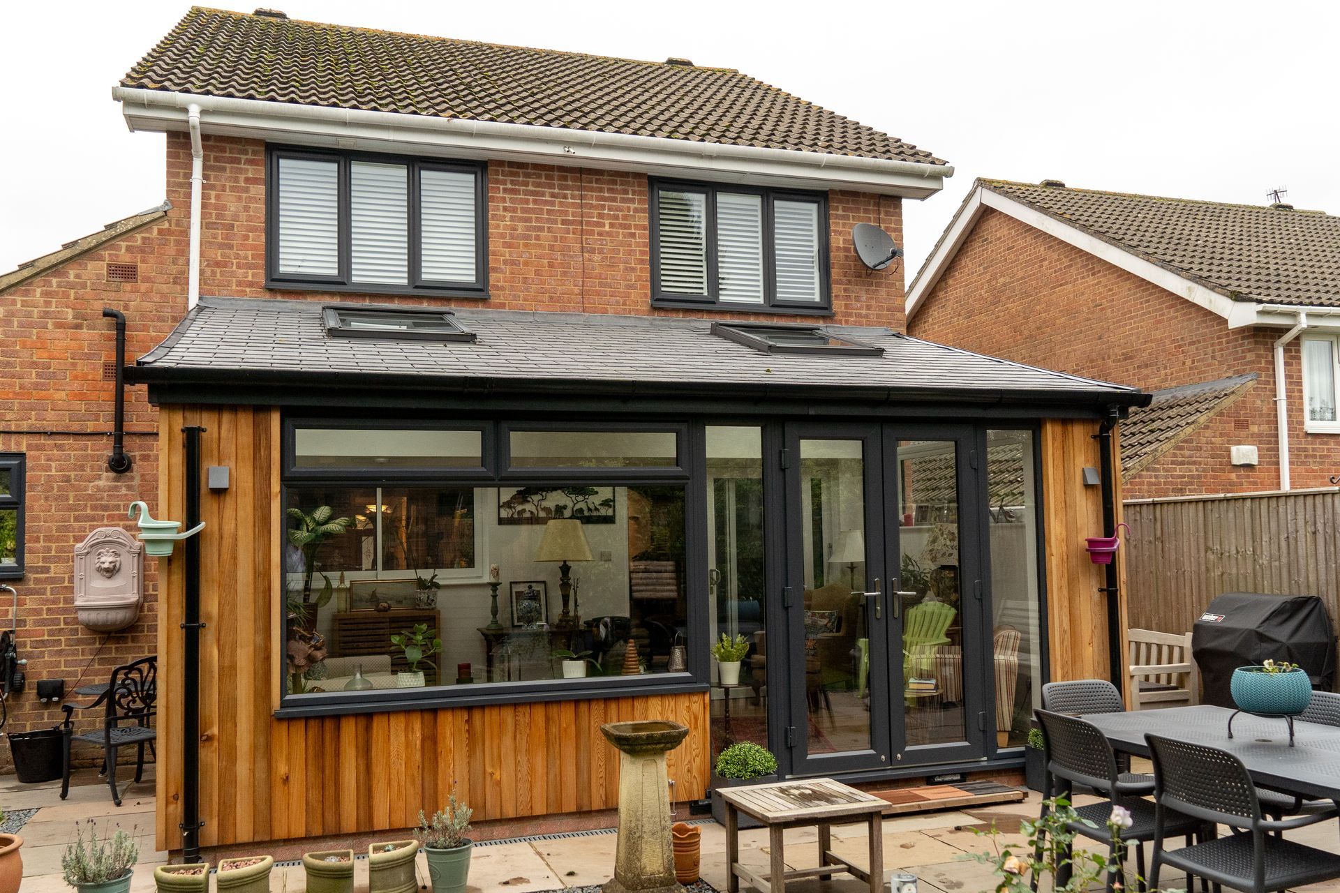 warm roof conservatory with vertical timber cladding in sussex