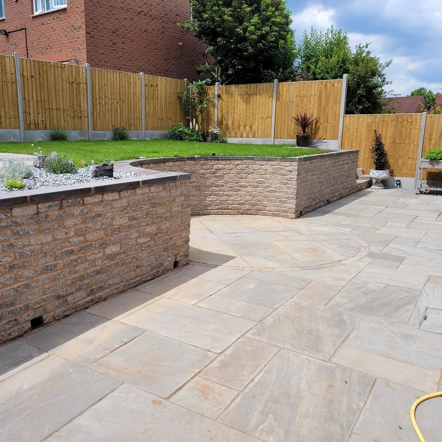 After DNA Landscapes had completed the curved retaining garden wall