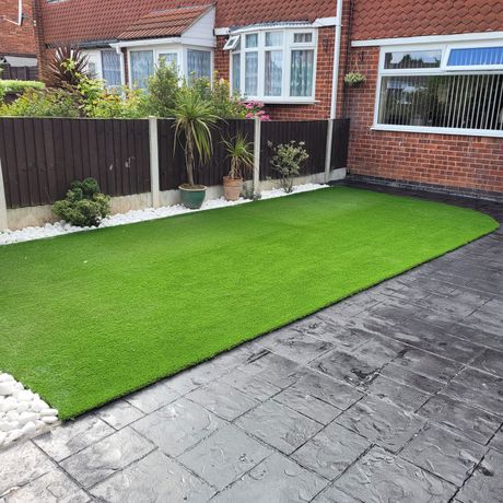 DNA Landscapes landscaping project involving new artificial grass and patterned concrete paving