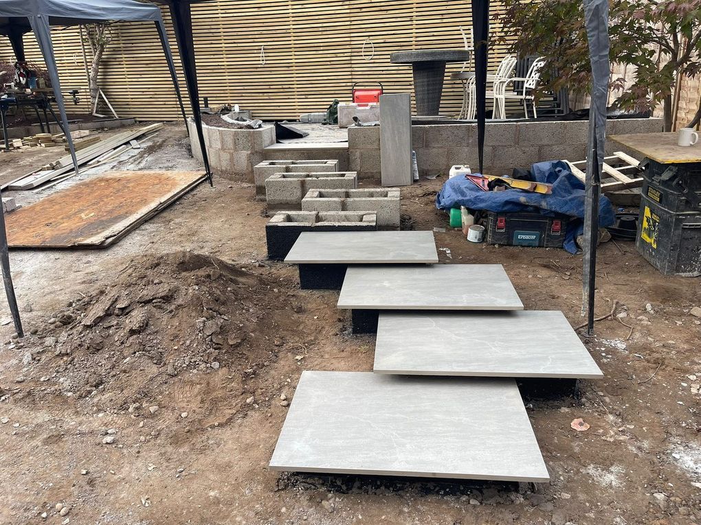 Porcelain floating-style steps being built on concealed supports during construction