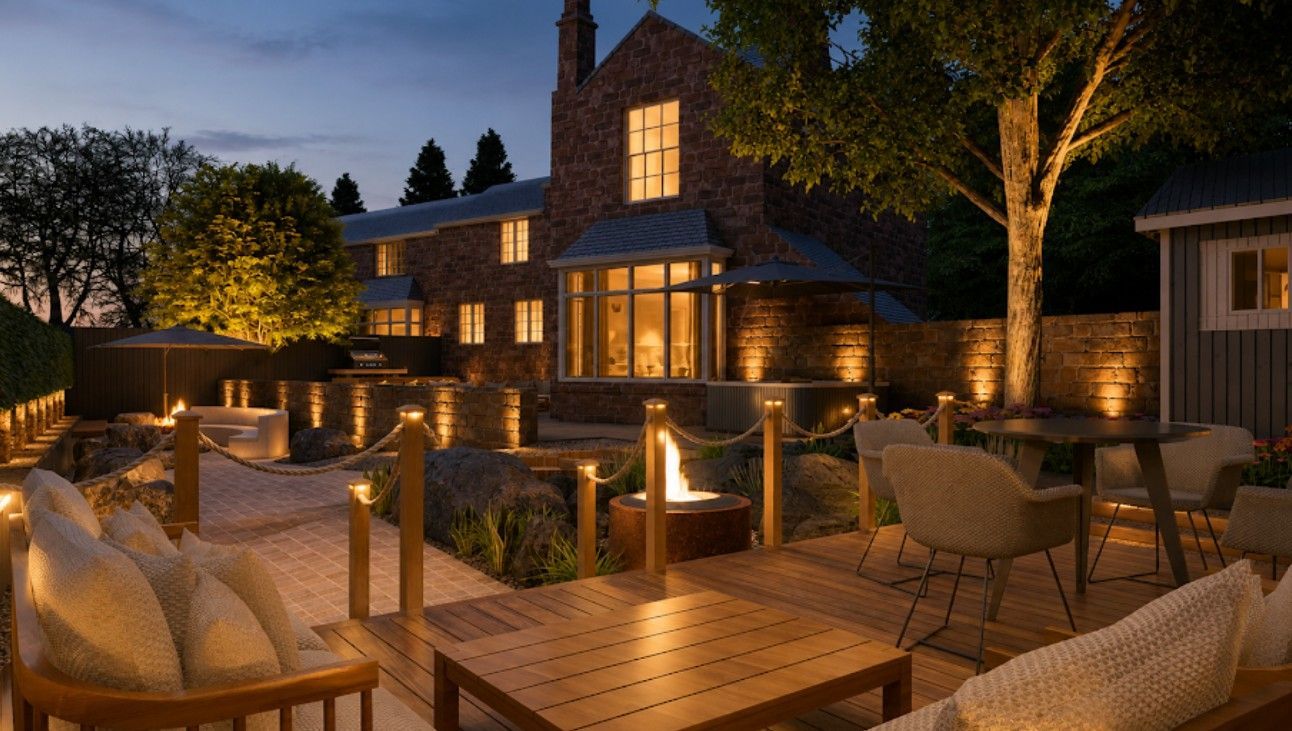 landscaped garden at nighttime with subtle garden lighting and a fire pit