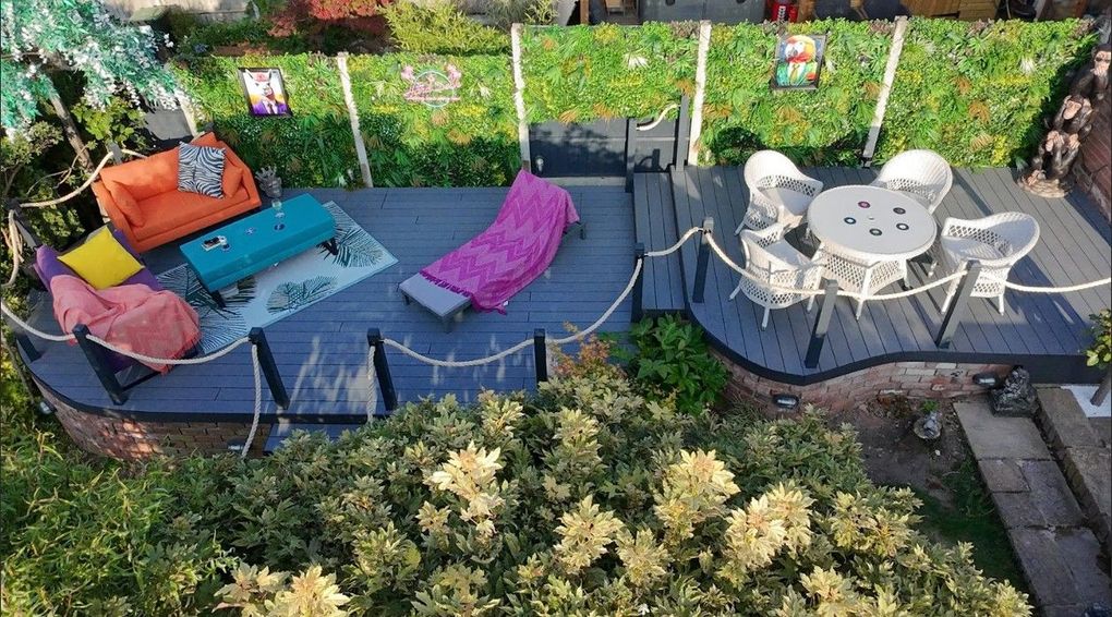 View from above of a two-part composite deck with lounge and dining areas built over an old pond in Galley Common, Nuneaton
