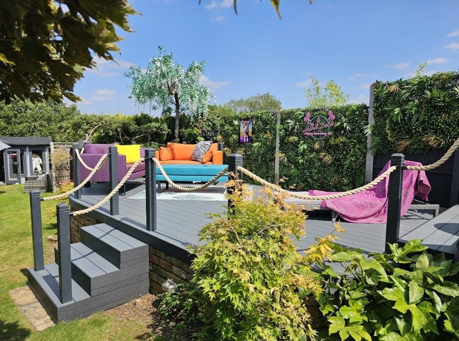 Composite decking, steps and established planting in a garden at Galley Common, Nuneaton