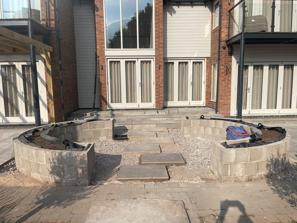 Curved blockwork planters built either side of new porcelain steps, before rendering