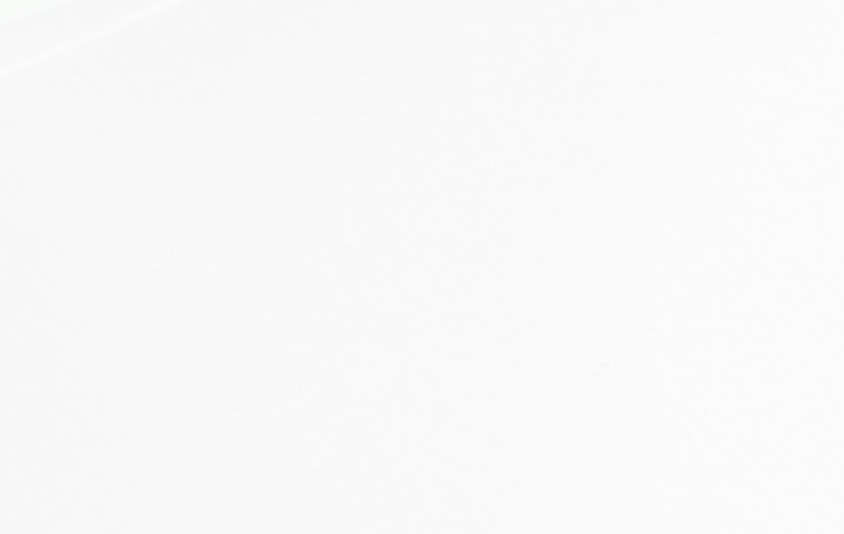 A close up of a white background with a plain texture.