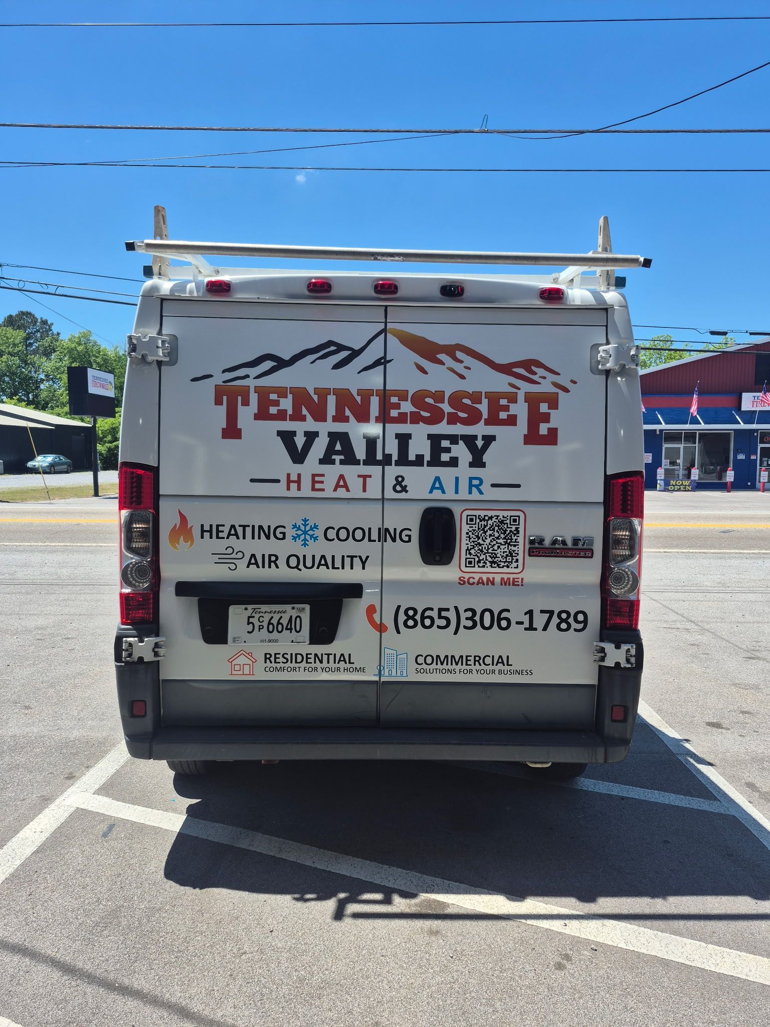 Back of Tennessee Valley Heat & Air service van in a parking lot under a blue sky
