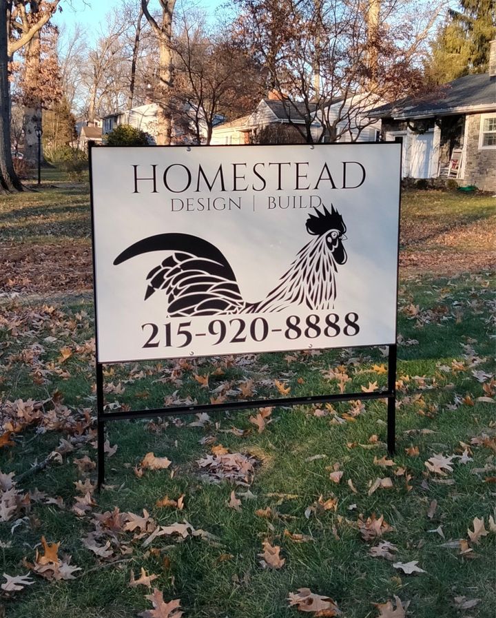 A sign with a rooster and the number 215-920-8888 on it