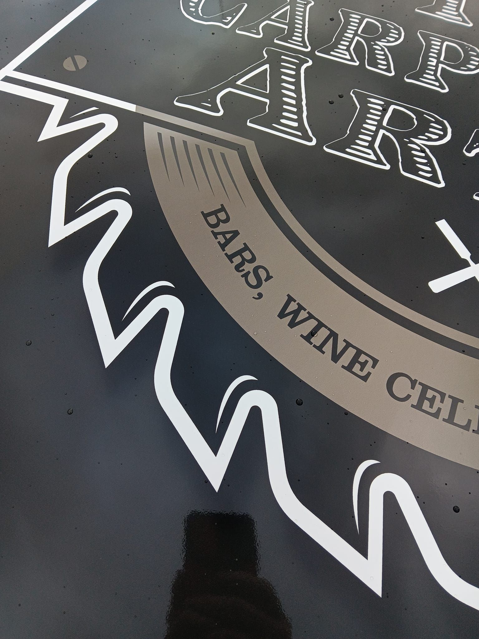 A sign that says bars wine cellars on it
