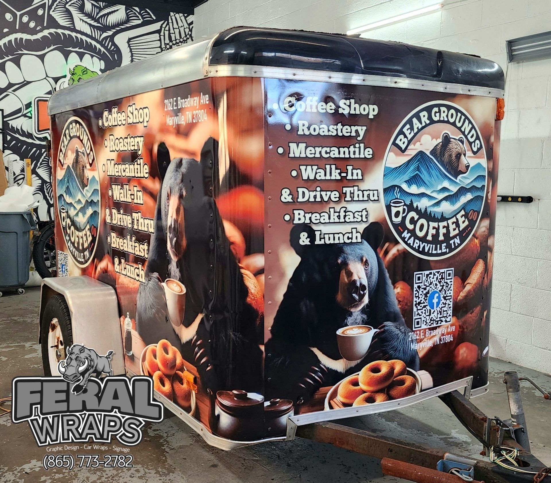 A trailer that says ' bear grounds coffee ' on it