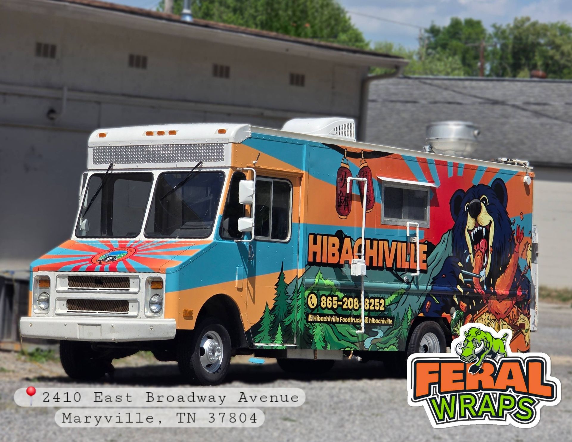 Colorful Feral Wraps food truck with Hibbaville mural parked by a warehouse.
