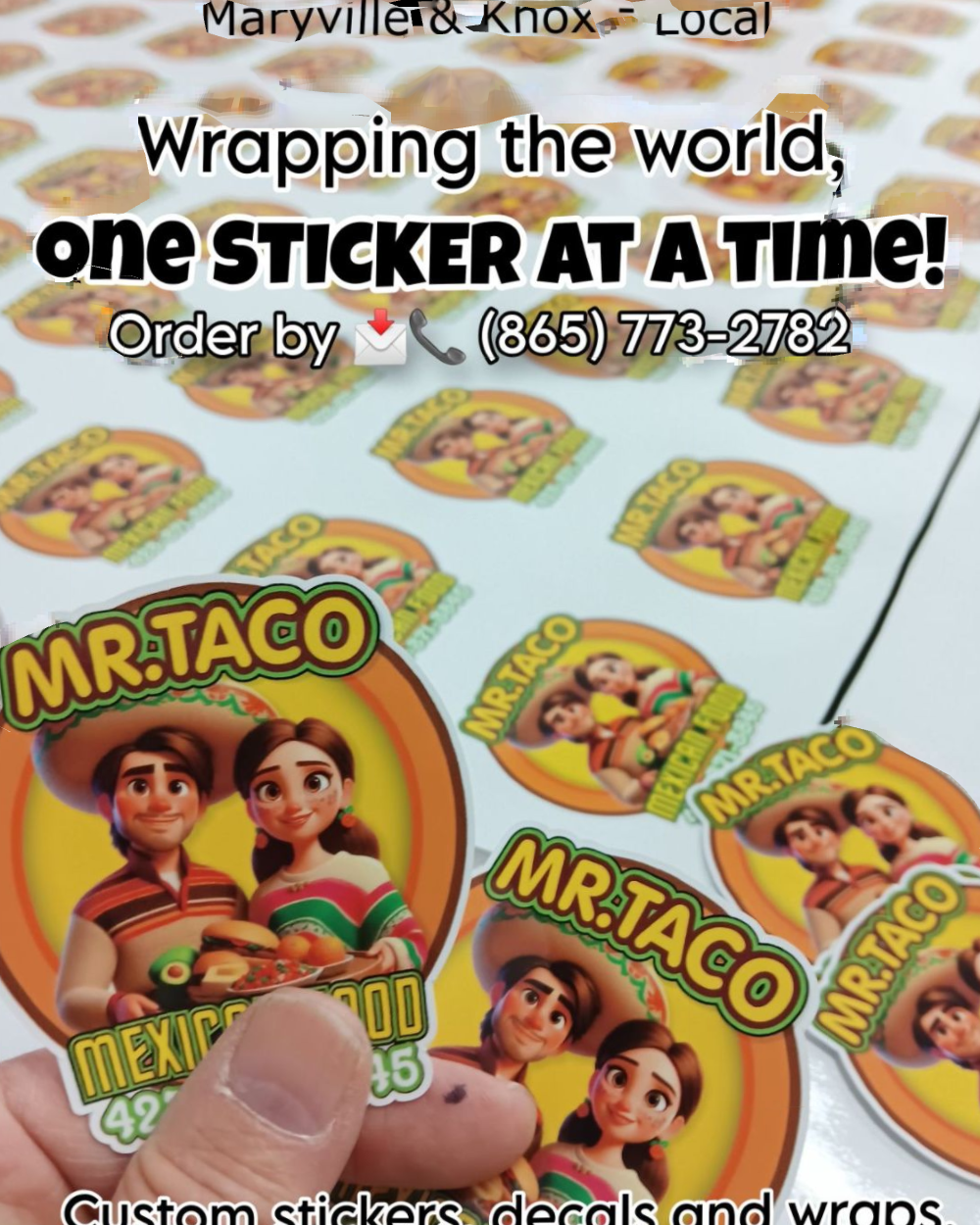 A hand is holding a sticker that says mr. taco