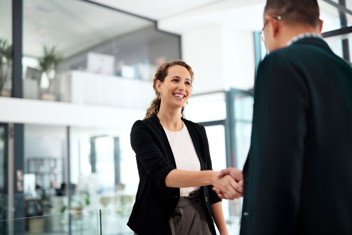 Businesswoman and Businessman Shaking Hands — San Antonio, TX — C. M. Ruffo General Insurance Businesswoman and Businessman Shaking Hands — San Antonio, TX — C. M. Ruffo General Insurance