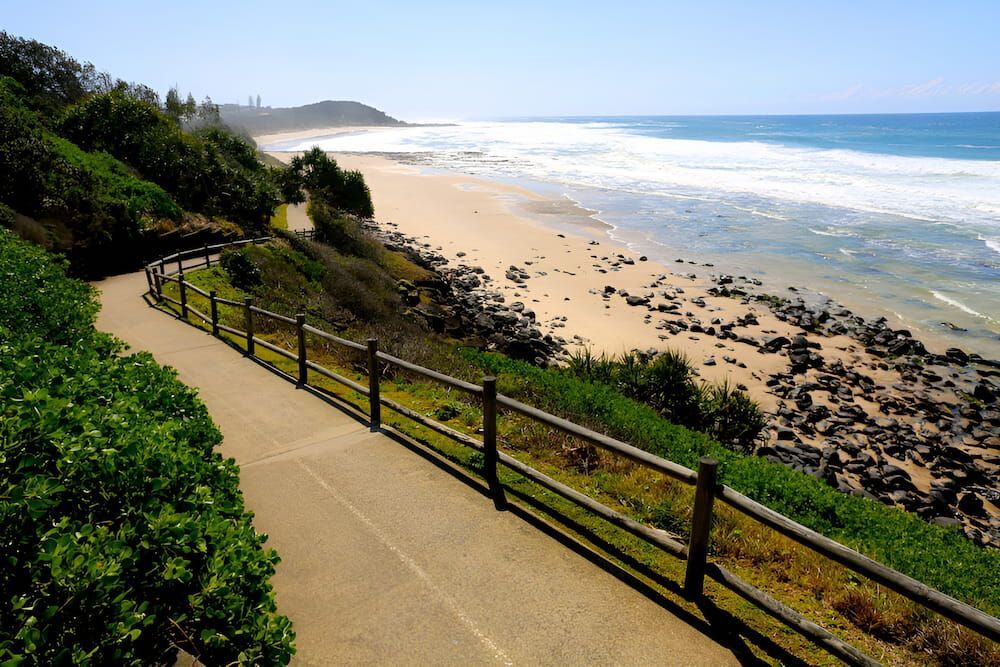 A Path Leading To A Beach With A Wooden Fence — Brunswick Valley Door Centre in Ballina, NSW