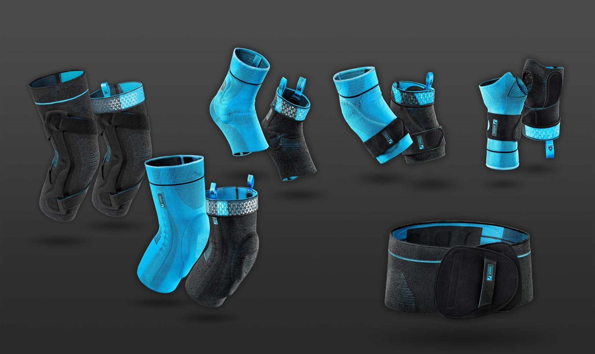 A collection of black and blue Ossur compression braces and support wraps for joints displayed against a dark background.