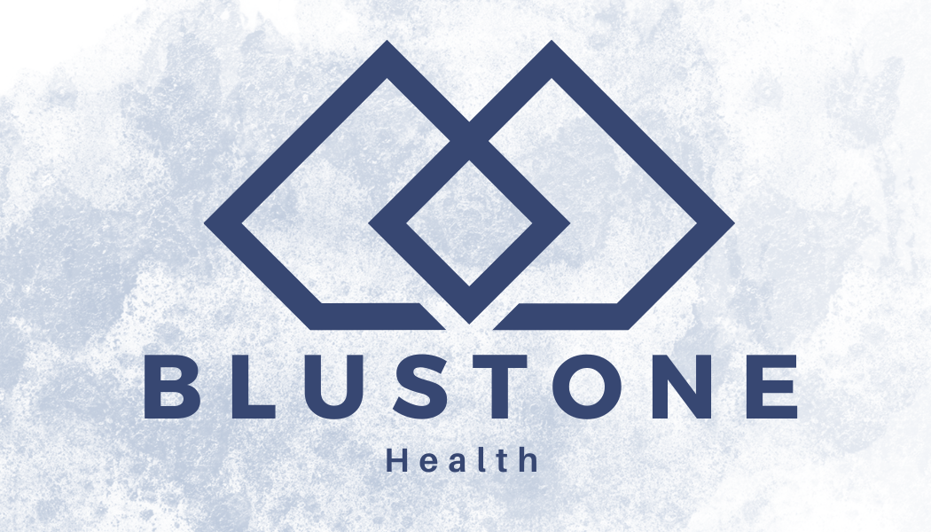 The Blustone Health logo: two interlocking dark blue geometric diamond shapes above the text 