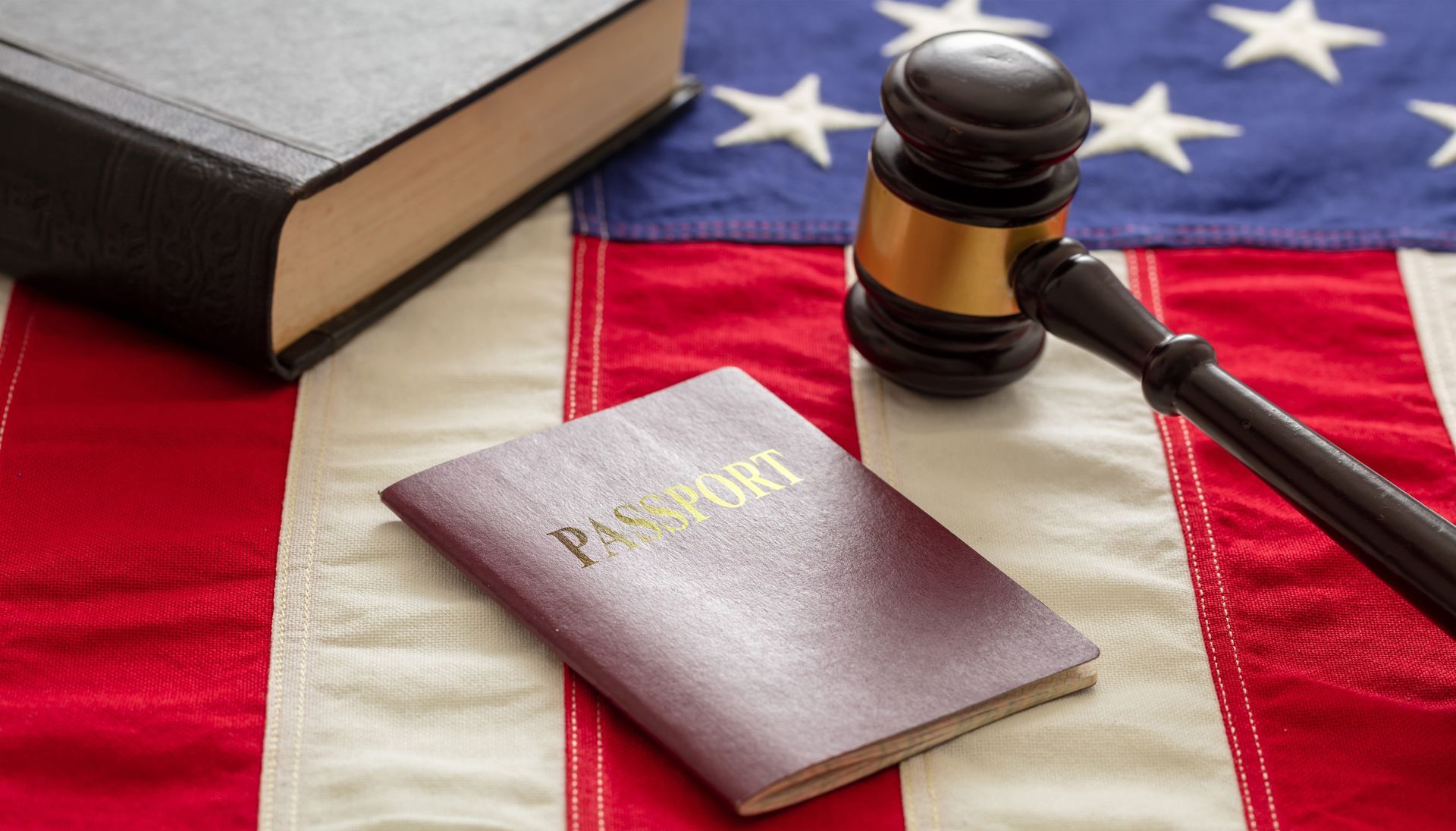 Gavel, law book, and U.S. flag, symbolizing the American justice system.
