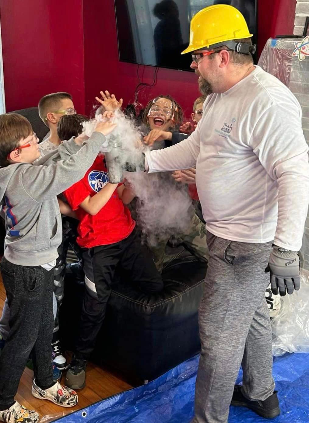 children enjoying a science show