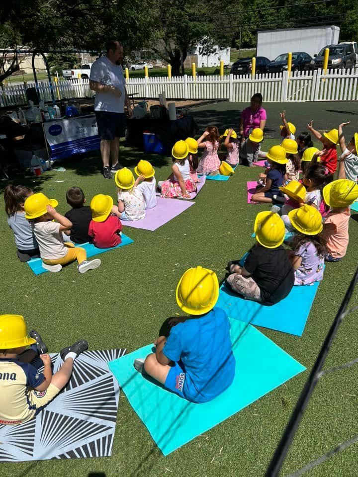 kids on towels to enjoy summer science show