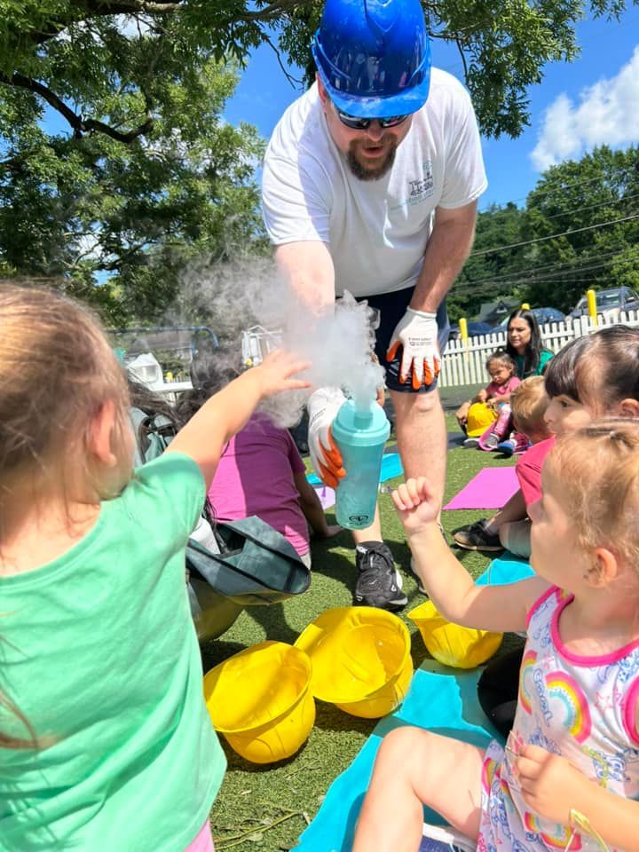 kids reaching out to touch the steam 