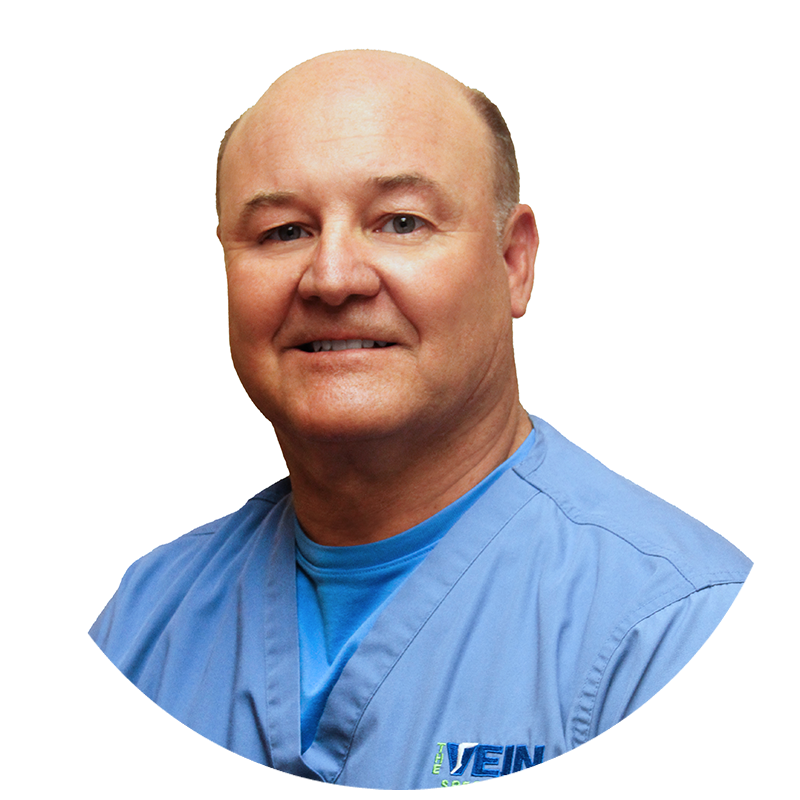 A bald man wearing a blue scrub with the word vein on the front