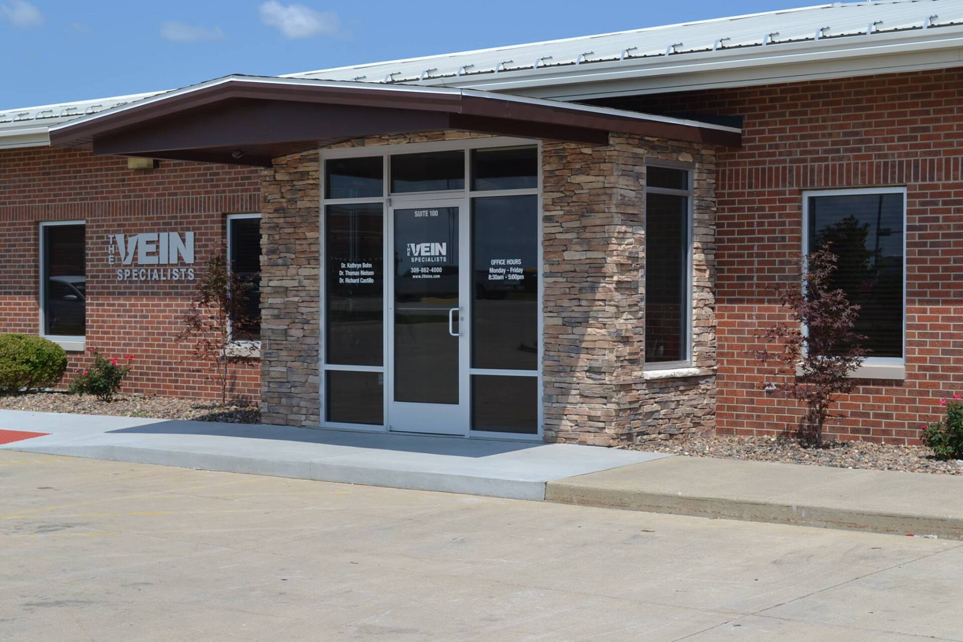 A brick building with the words The Vein Specialists on it