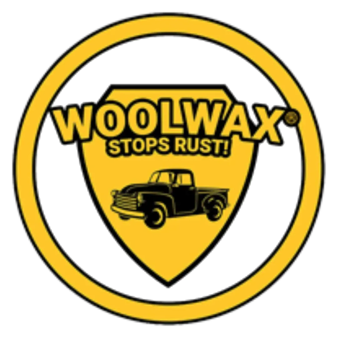 Yellow Woolwax logo with “STOPS RUST!” and a black pickup truck inside a shield.