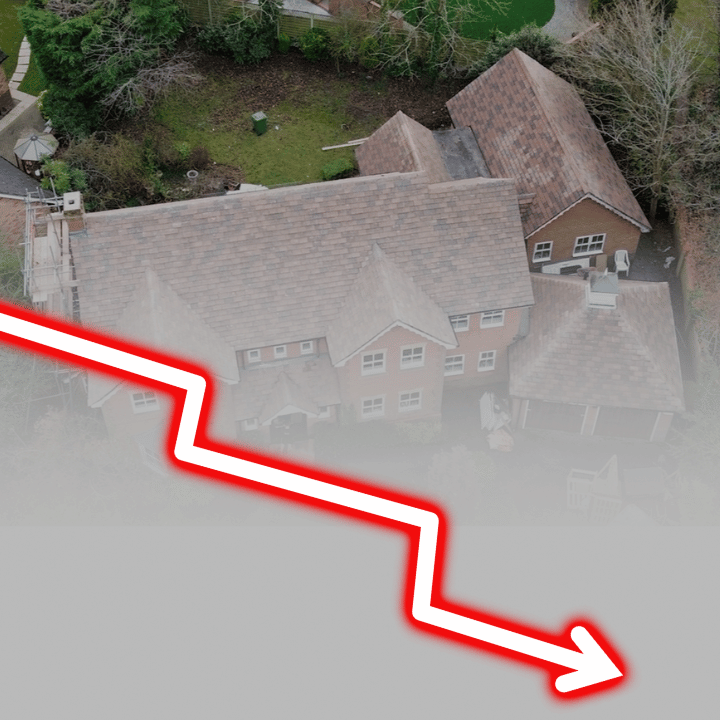 Aerial view of a house with a downward trending red and white line superimposed, suggesting a market decline.