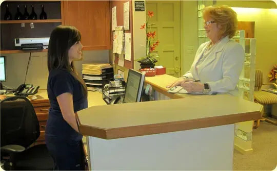 Woman checking into her eye appointment