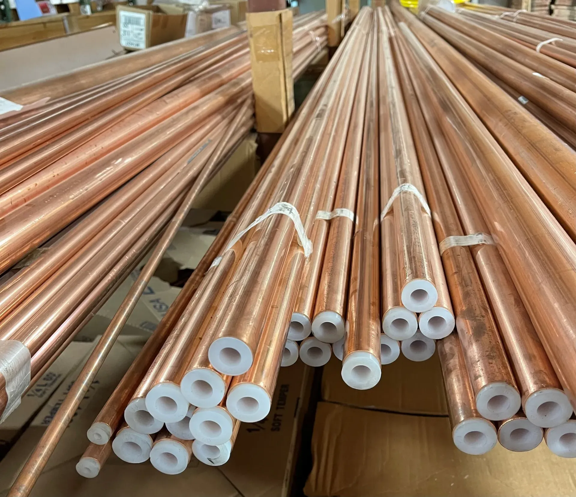 Generic stock photo of stacked copper plumbing pipes; it does not show the Winchester repair described in this article
