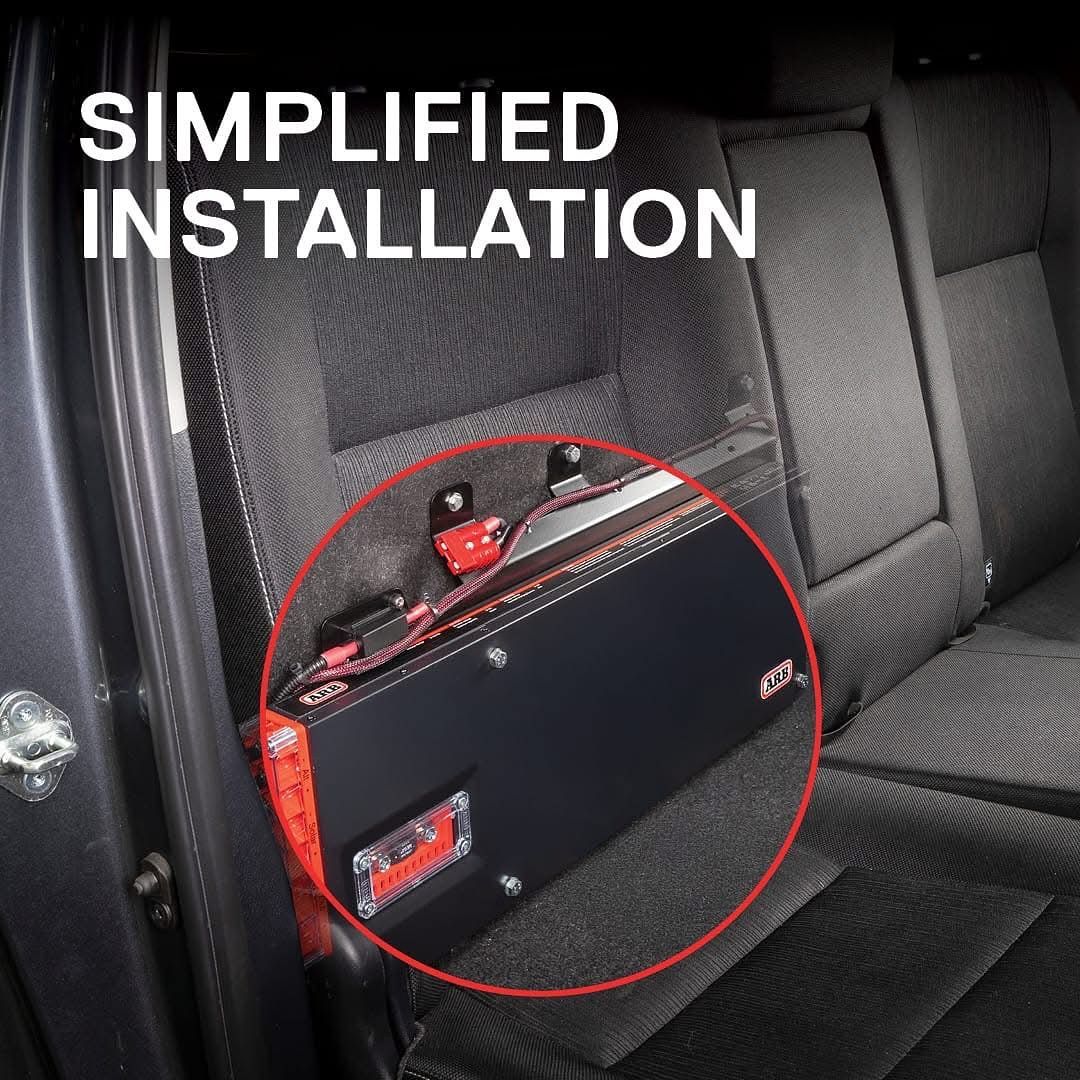 Car audio amplifier mounted on a car seat with red circle and “SIMPLIFIED INSTALLATION” text — Ol Mate 4x4 in Tuggerah, NSW