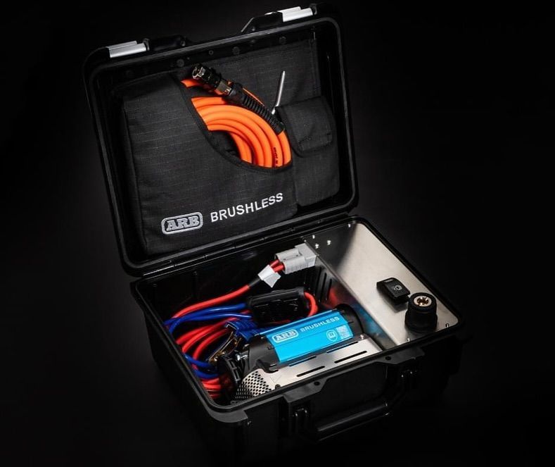 Open case with coiled orange cable and blue electronics inside, plus small accessories in a side compartment — Ol Mate 4x4 in Tuggerah, NSW