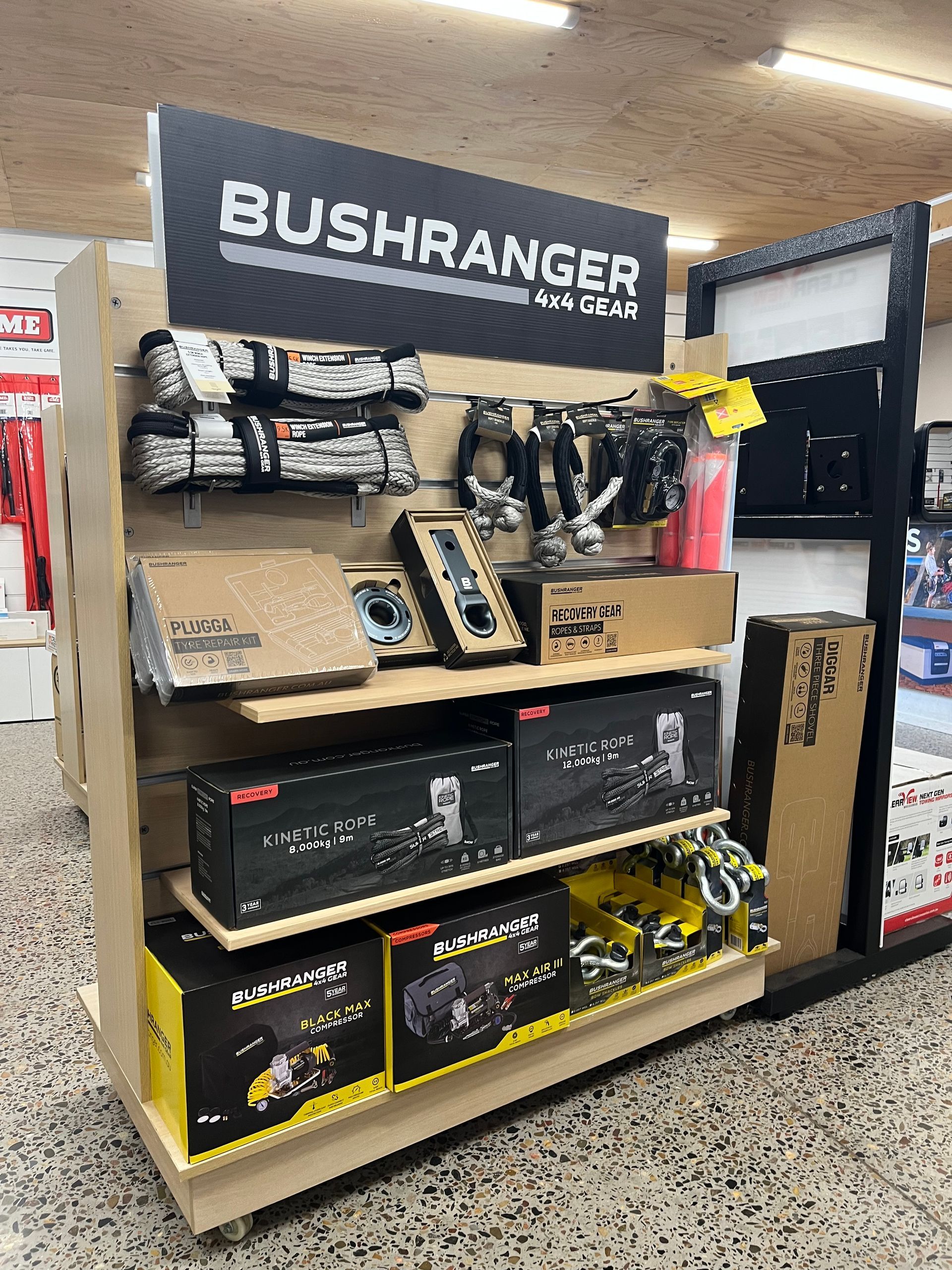 Bushranger-branded outdoor power tool display in a store aisle, with boxed equipment and accessories — Ol Mate 4x4 in Tuggerah, NSW