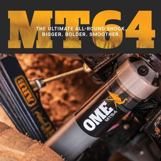 OME 4 shock absorber suspension close-up, with orange and black branding — Ol Mate 4x4 in Tuggerah, NSW