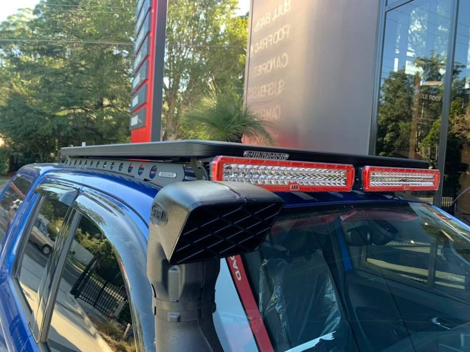 Blue off-road vehicle with roof lights and snorkel parked outdoors by a building — Ol Mate 4x4 in Tuggerah, NSW