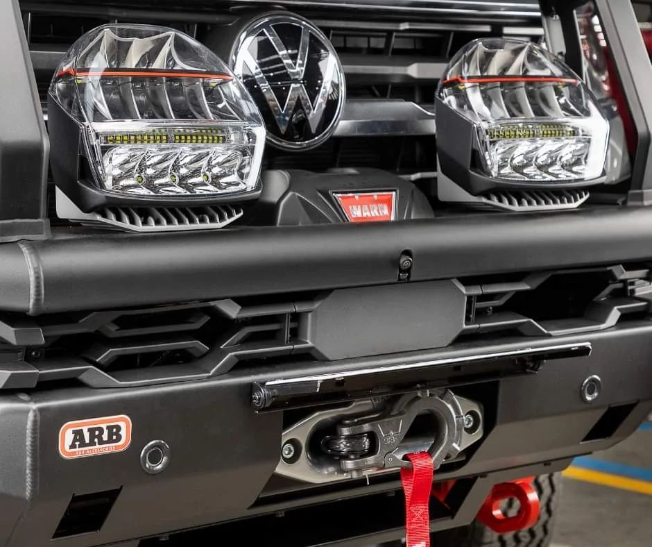 Front view of a black Volkswagen with ARB bull bar, off-road lights, and red recovery points — Ol Mate 4x4 in Tuggerah, NSW