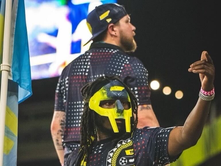 An image of two mixtape Capos staring at the crowd