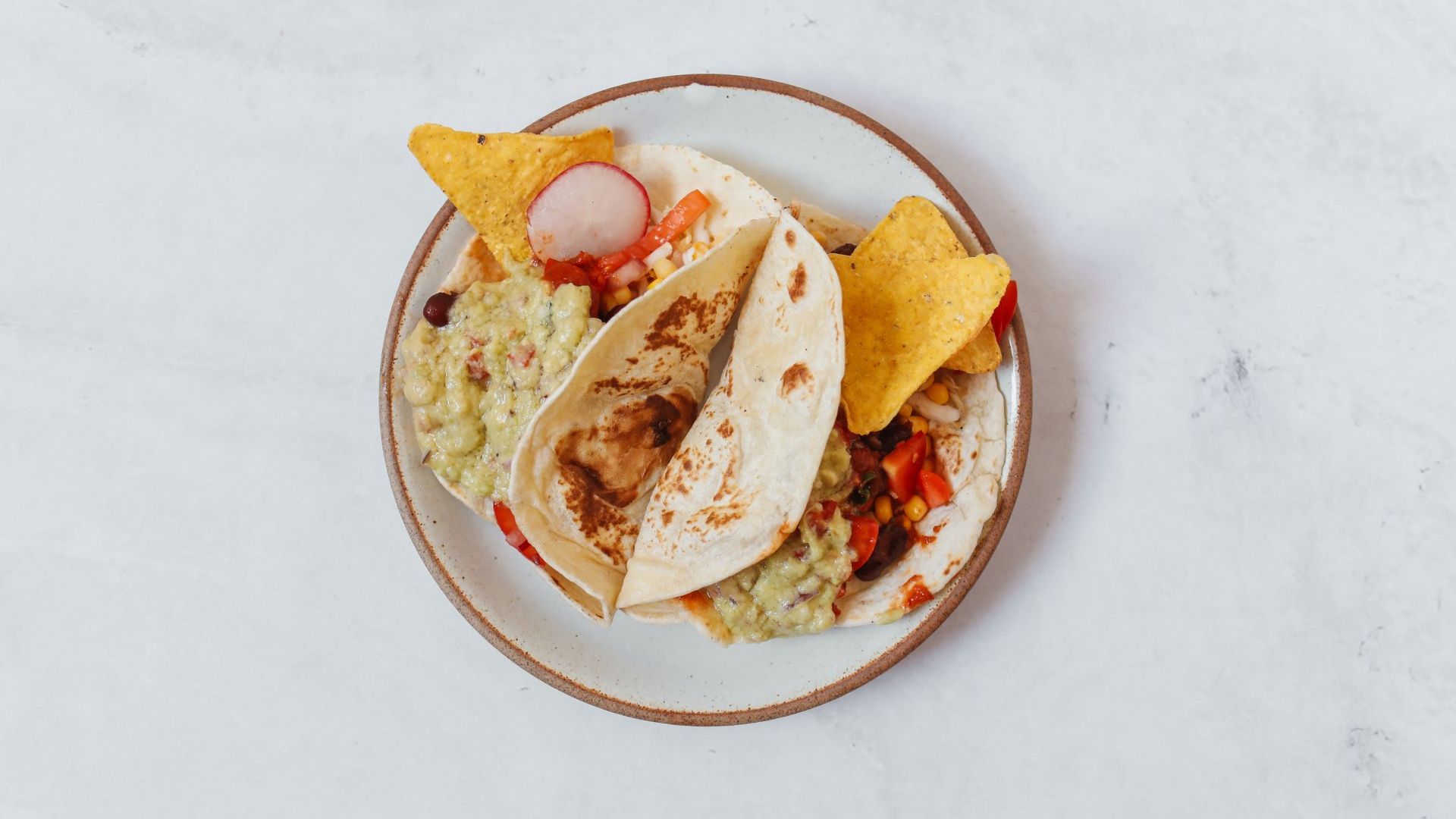 top view of a plate of tacos